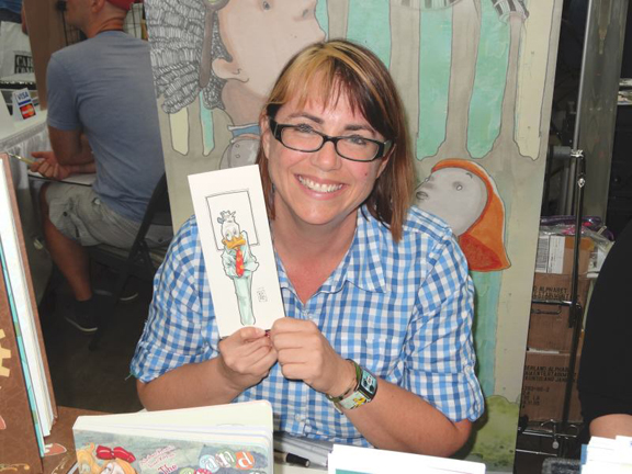 Janet K. Lee holding a terrific Howard the Duck piece she drew for me.